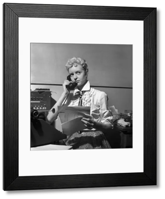 Framed Print : General office scene: Secretary taking notes and answering the phone in a Birmingham
