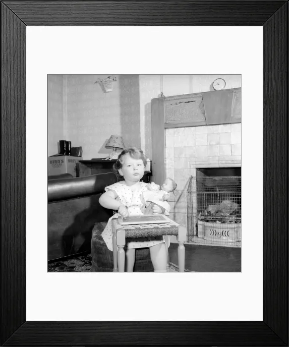 Framed Print : Small girl drawing beside the fireplace: Betty Hampson 36 month old school girl