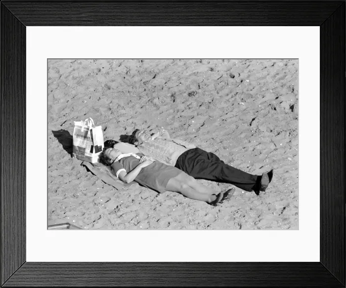 Framed Print : Holidays: Beach scenes: People relaxing at Margate enjoying the unusually fine warm Framed Print : Holidays: Beach scenes: People relaxing at Margate enjoying the unusually fine warm