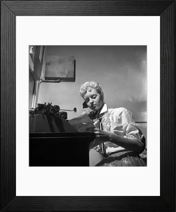 Framed Print : General office scene: Secretary taking notes and answering the phone in a Birmingham