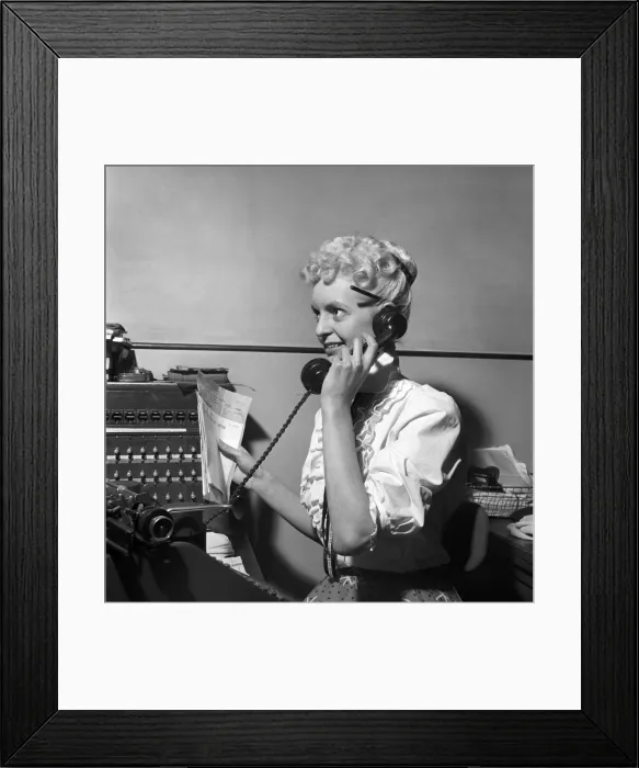 Framed Print : General office scene: Secretary taking notes and answering the phone in a Birmingham