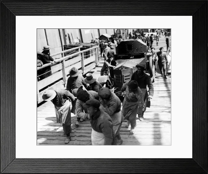 Framed Print : Tank Corps unloading armoured cars at Shanghai, China as workmen help to pull the cargo Framed Print : Tank Corps unloading armoured cars at Shanghai, China as workmen help to pull the cargo