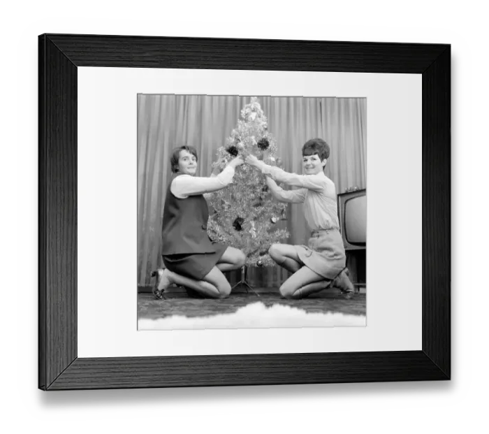 Framed Print : Two women decorating the Christmas Tree and enjoying a cup of tea. December 1969 Z12390 Framed Print : Two women decorating the Christmas Tree and enjoying a cup of tea. December 1969 Z12390