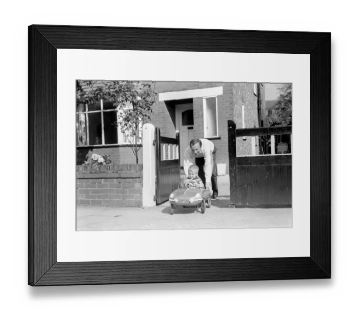 Framed Print : England Footballer Nobby Stiles seen here relaxing with his family