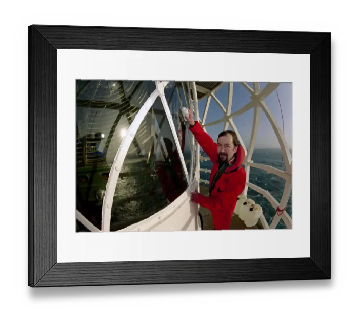 Framed Print : Lighthouse keeper Colin Jones seen here clearing the light during this last relief tour