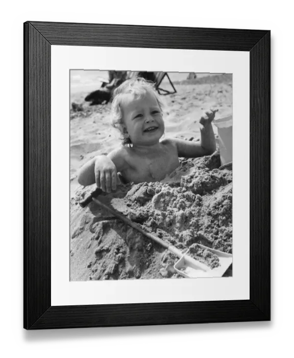 Framed Print : 3 year old Bradley Hook up to his arm-pits in the sand at Bournemouth. April 1971 P023604 Framed Print : 3 year old Bradley Hook up to his arm-pits in the sand at Bournemouth. April 1971 P023604