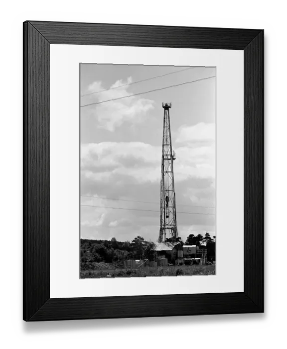 Framed Print : Oil well drilling for oil in Ireland. A farmhouse on the roadside has a grand stand view Framed Print : Oil well drilling for oil in Ireland. A farmhouse on the roadside has a grand stand view