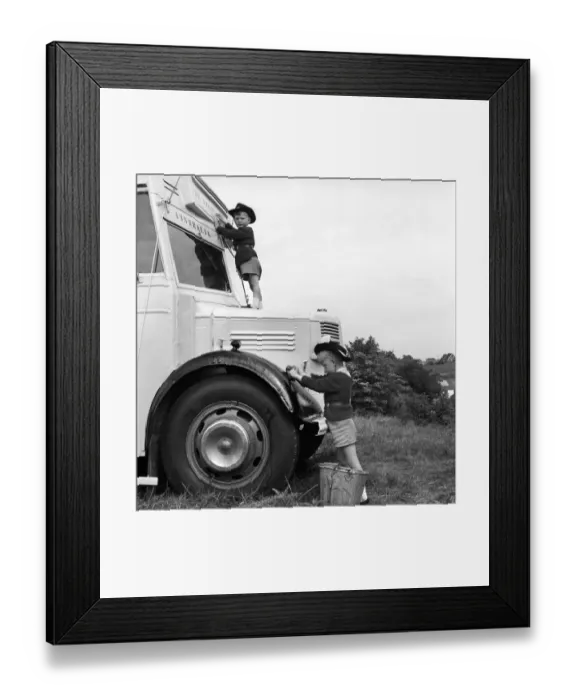 Framed Print : Long distance bus journey. The Drew family seen here with their converted bus in which