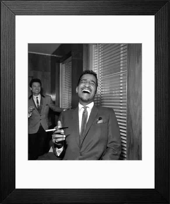 Framed Print : Sammy Davis Jnr at a press reception in Soho cinema showing slips of his new film Robin