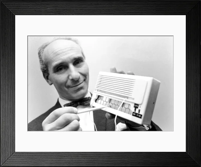 Framed Print : Inventor Bert Coleman shows how to play a note on his electronic mini organ Framed Print : Inventor Bert Coleman shows how to play a note on his electronic mini organ
