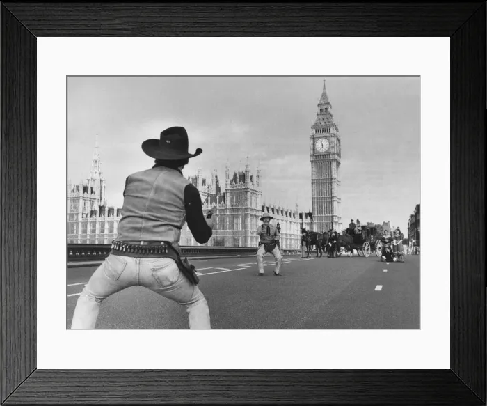 Framed Print : Cowboys: Wild Westminster. Reach! Its a hold-up on the bridge as the gunmen stage Framed Print : Cowboys: Wild Westminster. Reach! Its a hold-up on the bridge as the gunmen stage