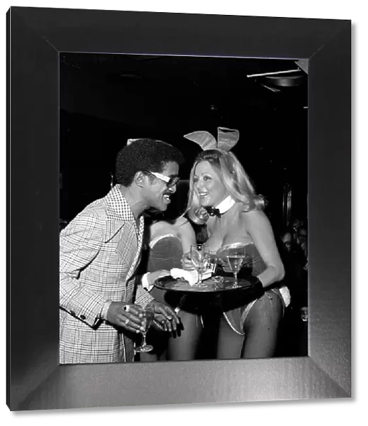 Sammy Davis party. Sammy Davis Jnr. talking to a Bunny Girl. 12th May 1973