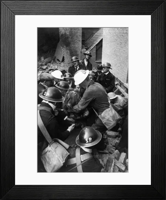 Framed Print : Blitz, London. Girl is dragged from the rubble on Endell Street during the Second World Framed Print : Blitz, London. Girl is dragged from the rubble on Endell Street during the Second World