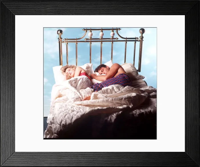 Framed Print : Couple asleep in four poster bed Framed Print : Couple asleep in four poster bed