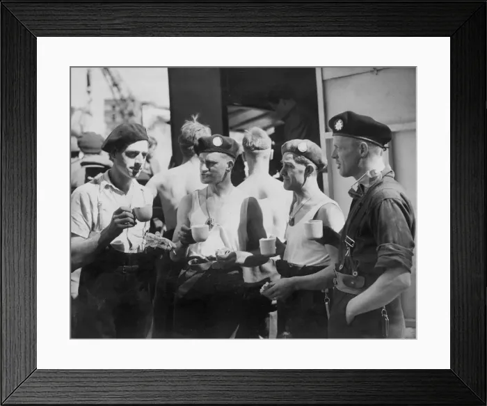 Framed Print : Firemen wearing their Second Front'berets assisting their colleagues in Framed Print : Firemen wearing their Second Front'berets assisting their colleagues in