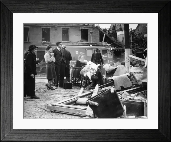 Framed Print : Doctor Waters, wearing glasses, watches rescue work in progress after a V2 Bomb fell Framed Print : Doctor Waters, wearing glasses, watches rescue work in progress after a V2 Bomb fell