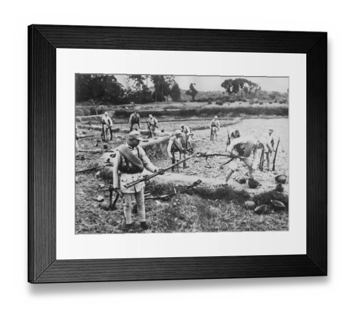 Framed Print : Chinese soldiers pick up the discarded weapons of Japanese soldiers who have fled Framed Print : Chinese soldiers pick up the discarded weapons of Japanese soldiers who have fled