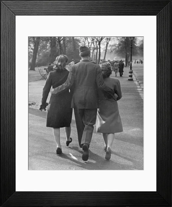 Framed Print : Easter Parade in Hyde Park, April 9th 1944. OPS A soldier with a woman on each arm Framed Print : Easter Parade in Hyde Park, April 9th 1944. OPS A soldier with a woman on each arm