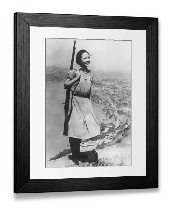 Framed Print : A smiling young girl, who is a soldier in the Chinese army during the Second World War