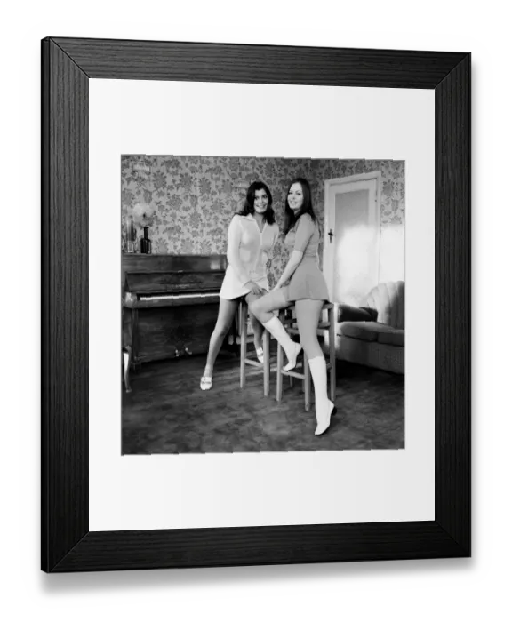 Framed Print : The two Michelle sisters of Chigwell, Essex come into view on the television screens Framed Print : The two Michelle sisters of Chigwell, Essex come into view on the television screens