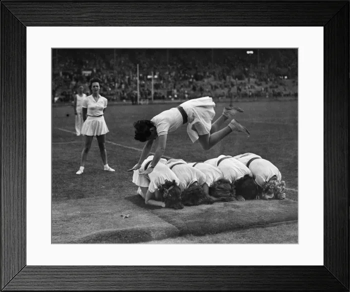 Framed Print : N. F.s girls do their agilities show for the crowd. Augurst 1943 P009986