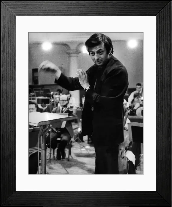 Framed Print : Pictures of conductor Andre Previn in action during a record session with the London