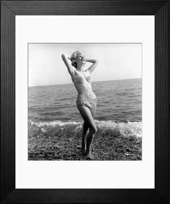 Framed Print : Model Angela Williamson on the beach. June 1960 M4326