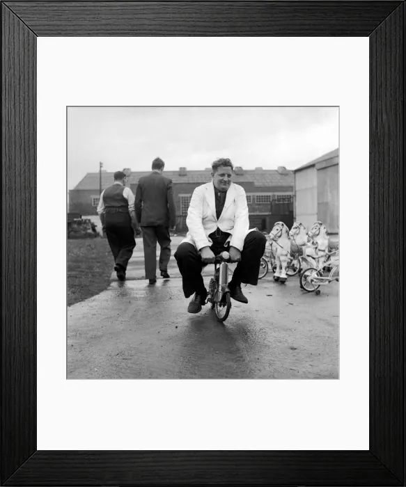 Framed Print : Man testing childrens toys bicycles and rocking horses. December 1953 D7321 Framed Print : Man testing childrens toys bicycles and rocking horses. December 1953 D7321