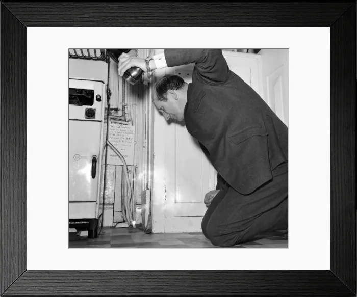 Framed Print : Humour: The Rev Brian Bason shoe in hand prepares to make a kill in his battle with Framed Print : Humour: The Rev Brian Bason shoe in hand prepares to make a kill in his battle with