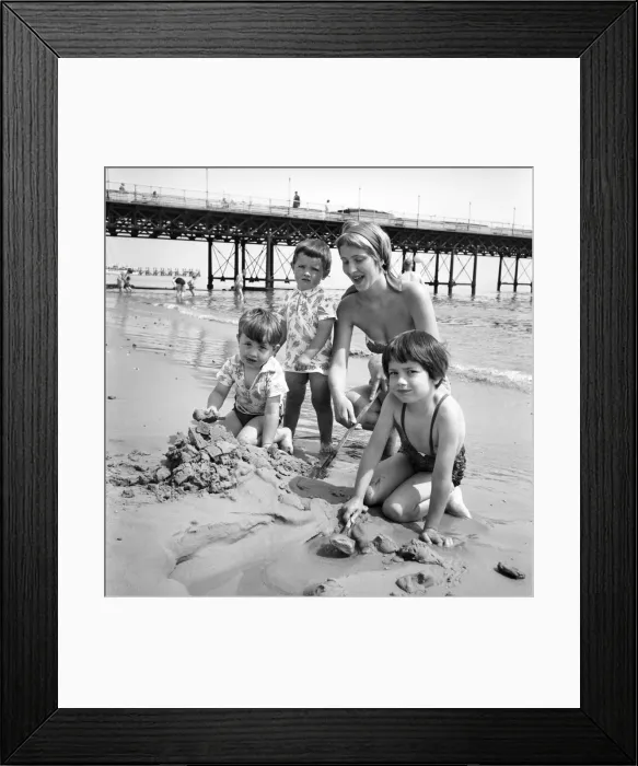 Framed Print : 19 year old nanny Birte Anderson on the beach at Bournemouth with children Elizabeth (6) Framed Print : 19 year old nanny Birte Anderson on the beach at Bournemouth with children Elizabeth (6)