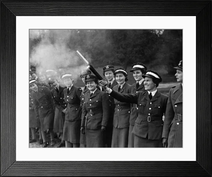 Framed Print : World War II Women: W. A. A. F.s in training. How to tackle an incendiary