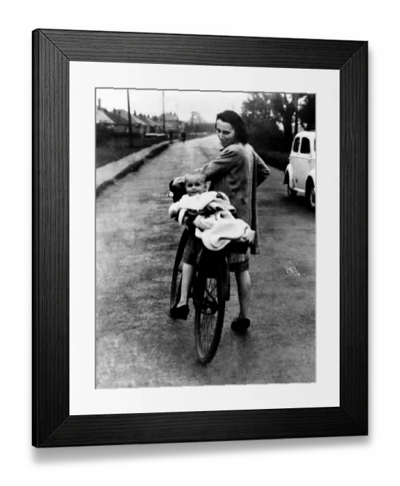 Framed Print : World War II: Britain Blitz. Women and baby seen here leaving the city for the country