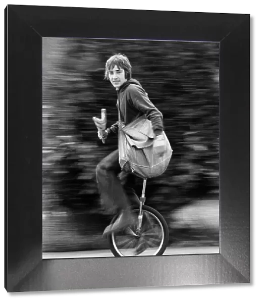 Newsboy Nigel Safe aged 14, knows what makes his paper round run smoothly- his unicycle
