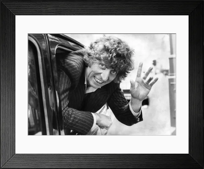 Framed Print : English actor Tom Baker waving from the back of a taxi. October 1980 P003678 Framed Print : English actor Tom Baker waving from the back of a taxi. October 1980 P003678