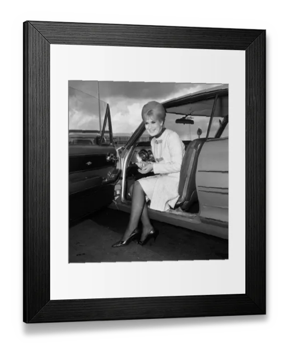 Framed Print : Pop singer Dusty Springfield at London airport before leaving for New York April
