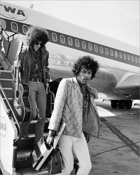 Jimi Hendrix arrives with members of his band 'The Jimi Hendrix Experience'