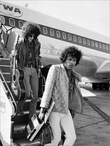 Jimi Hendrix arrives with members of his band 'The Jimi Hendrix Experience'