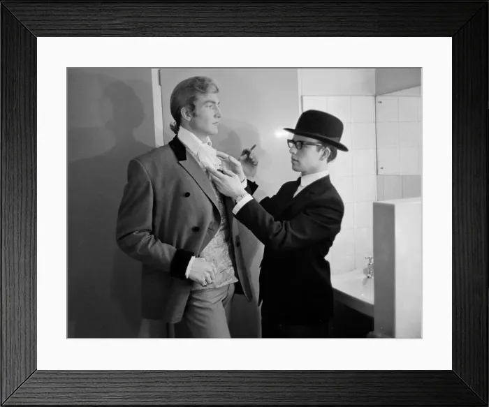 Framed Print : Pop singer Beau Brummel receives a helping hand with his cravatte from his valet Jeffers Framed Print : Pop singer Beau Brummel receives a helping hand with his cravatte from his valet Jeffers