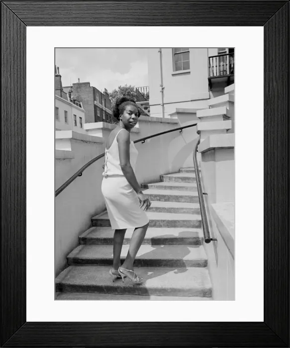 Framed Print : Singer Nina Simone stands on the steps of Philips record company building at Stanhope