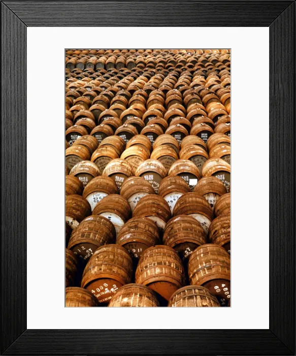 Framed Print : Empty casks used in the production of whisky awaiting filling at the Distillery