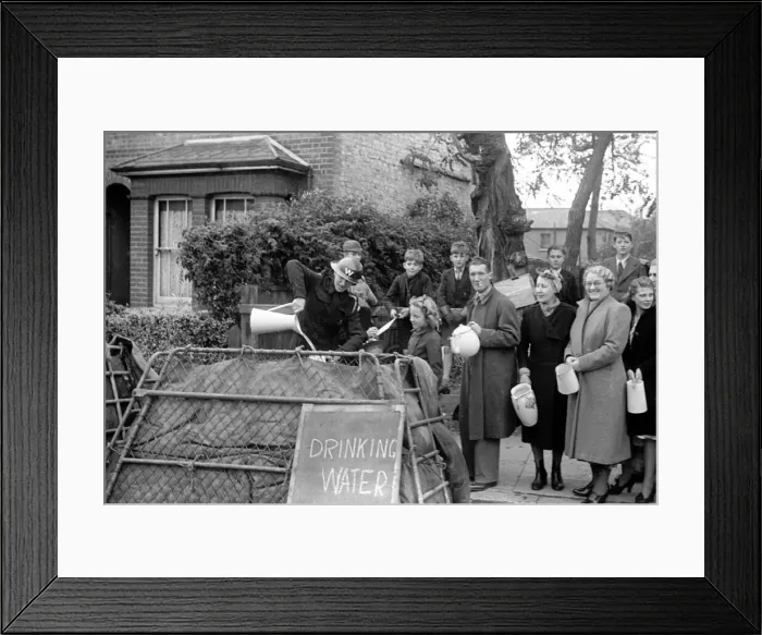 Framed Print : Alfieri. Civil Guard pours out drinking water during Invasion Exercises, Kingston, London Framed Print : Alfieri. Civil Guard pours out drinking water during Invasion Exercises, Kingston, London