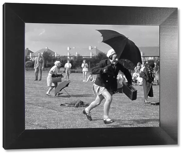 The umbrella race during a schools sports day in Kingston Upon Thames. Circa 1936