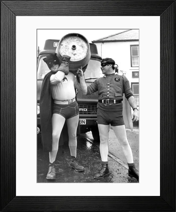 Framed Print : Draymen Jim Evans (Batman) and Eric Wilson (Robin) deliver beer at Easington in 1977 Framed Print : Draymen Jim Evans (Batman) and Eric Wilson (Robin) deliver beer at Easington in 1977