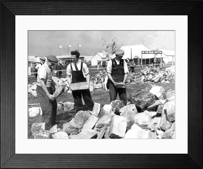 Framed Print : It might look like just a pile of rubble but in fact these three men were displaying