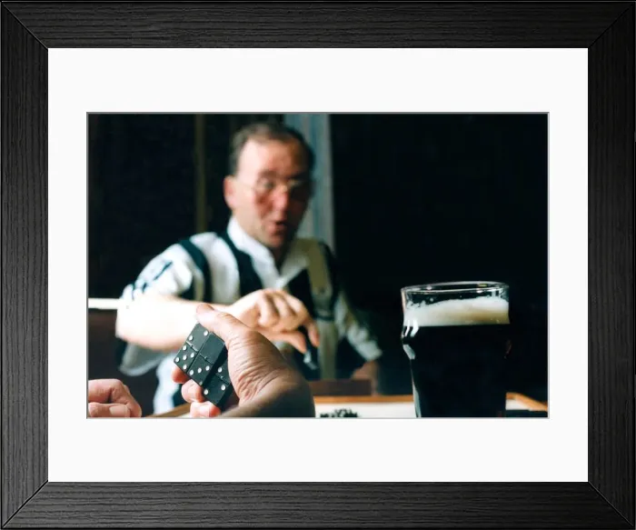 Framed Print : Stephen Harrison plays dominoes at his local club Framed Print : Stephen Harrison plays dominoes at his local club