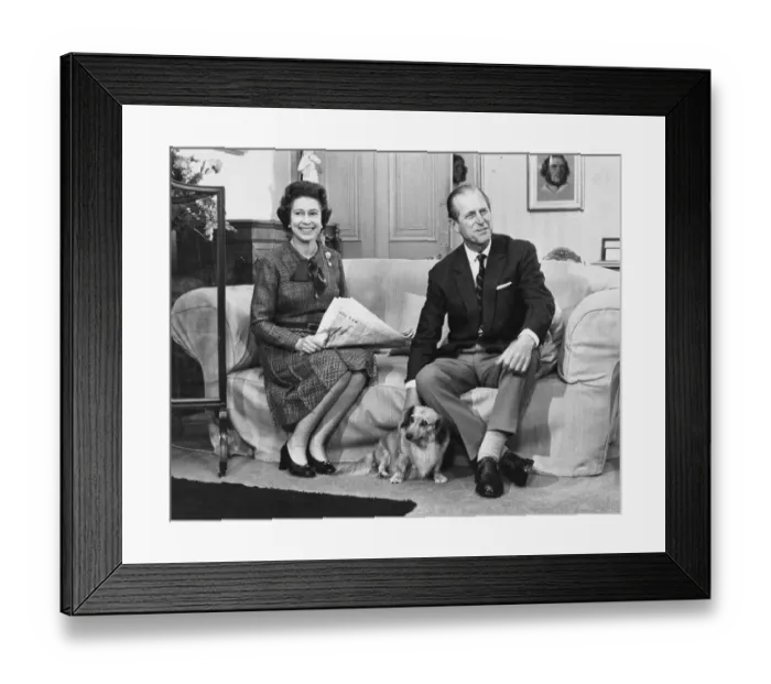 Framed Print : Queen Elizabeth II with Prince Philip and one of the family corgi