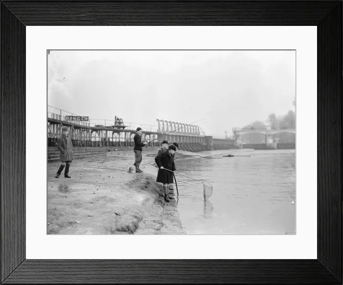 Framed Print : Schoolboys fishing at Teddington Weir during the winter drought of 1933 Framed Print : Schoolboys fishing at Teddington Weir during the winter drought of 1933