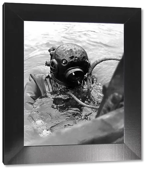 A diver in an old fashioned diving suit which you had to be bolted into