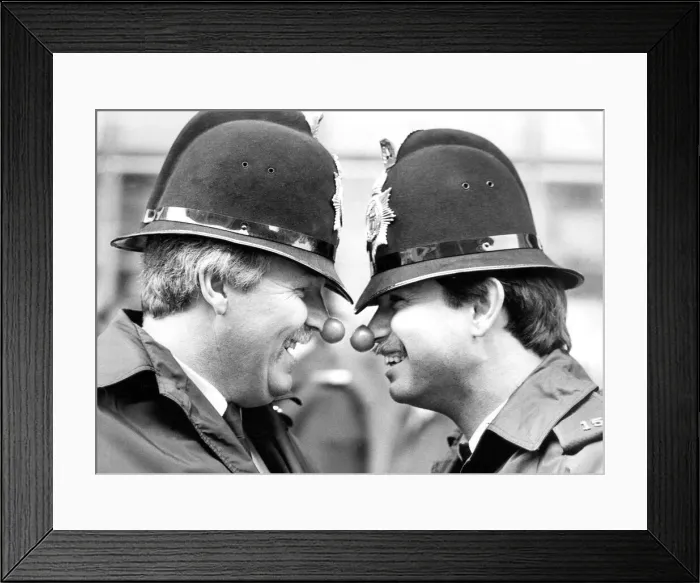 Framed Print : PCs Mike Allen and Steve Oliver, the laughing policemen get in on the red nose act