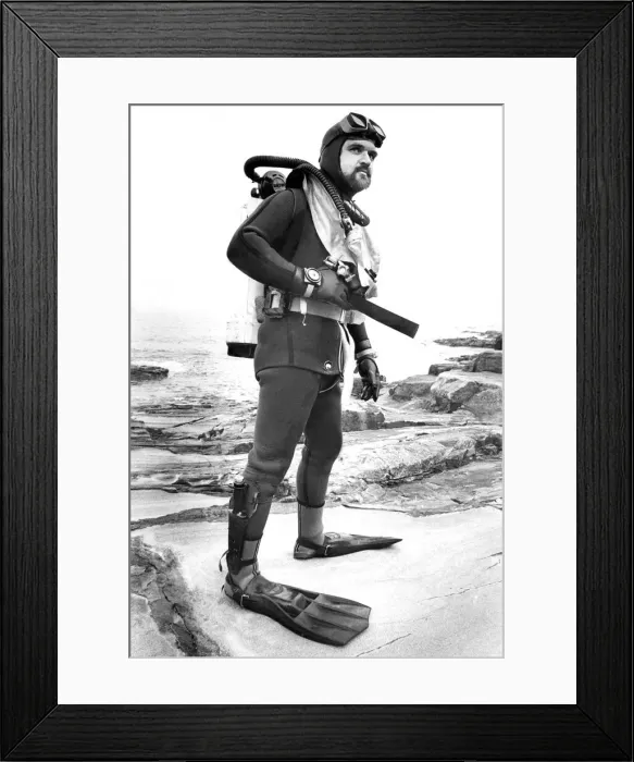 Framed Print : A diver showing the equipment that is needed for this hobby Framed Print : A diver showing the equipment that is needed for this hobby